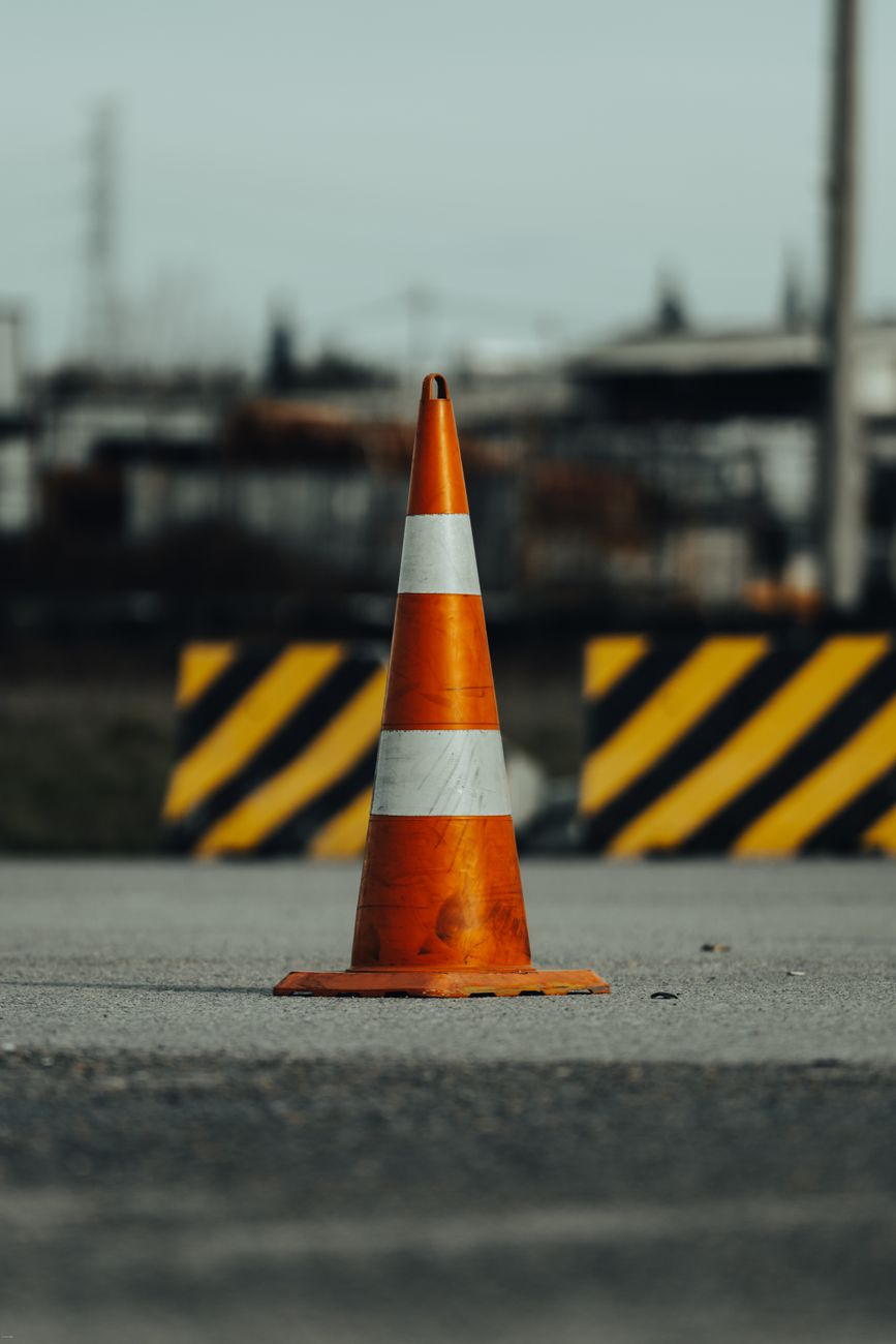orange traffic cone on urban street